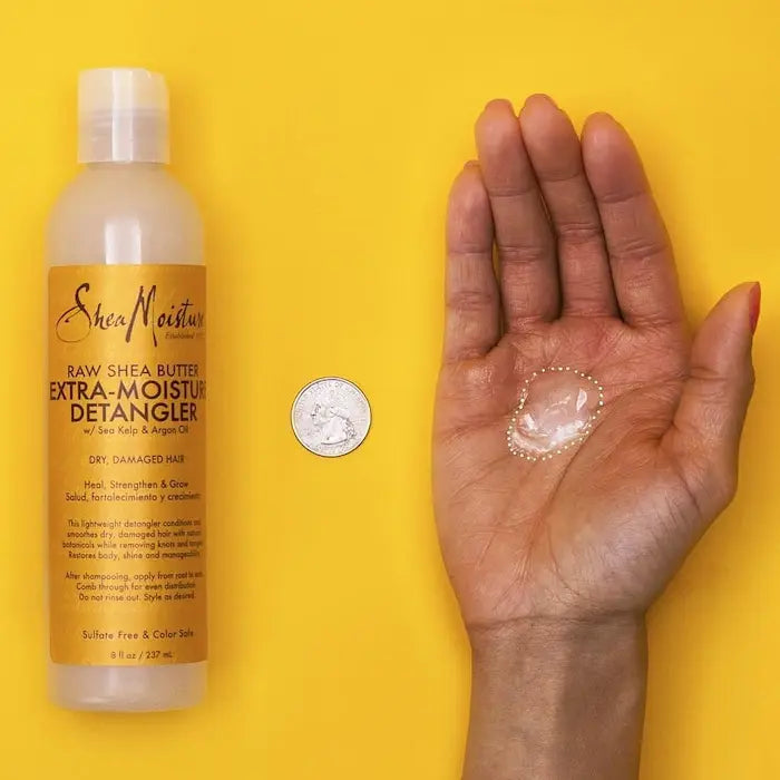 Après-shampoing Leave-in Extra nourrissant Raw Shea Butter Extra Moisture Detangler de Shea Moisture.  Il a des des propriétés extra nutritives et extra démêlantes.