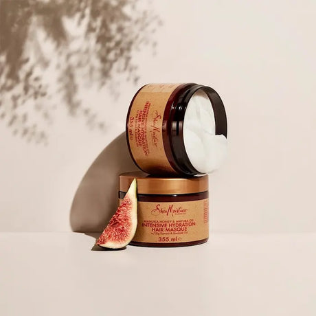 Shea Moisture Masque Profond au miel de manuka et Huile de Mafura formulé pour réhydrater les cheveux en profondeur.