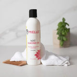 Huile soin Mint Almond Oil Mielle Organics Essentials. Riche en acides gras oméga 3 & 6 qui favorise la santé des cheveux, elle hydrate et nourrit le cuir chevelu, réduit la sécheresse et les démangeaisons.