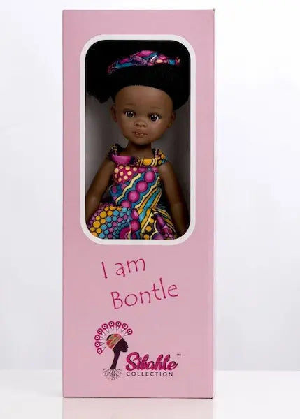 Poupée noire aux cheveux afro crépus. Bontle mesure 32cm. Robe Wax et Organza.